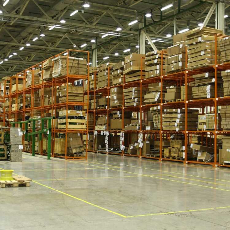 Large commercial warehouse with orange steel racks